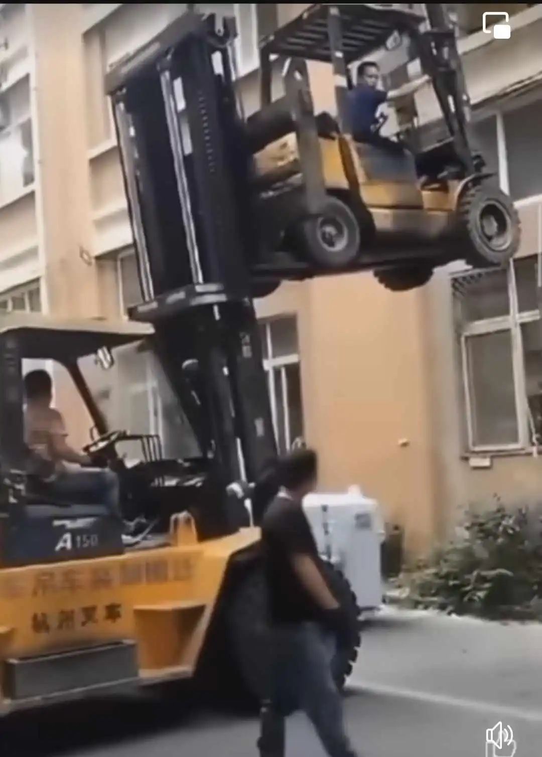 forklift lifting another forklift